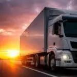semi-truck-highway-sunset_23-2152005477